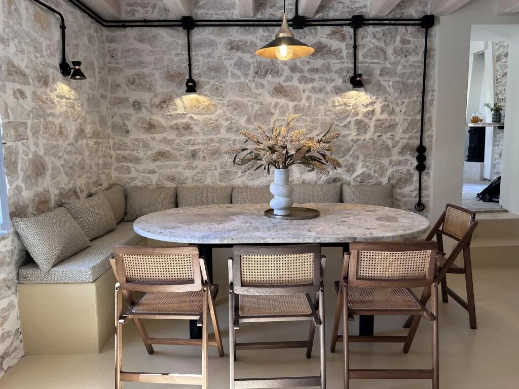 Dining table, stone walls